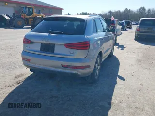 2015 Audi Q3 2.0T Premium Plus with VIN WA1EFCFSXFR010015, listed as a IAAI auction lot 42099410 with 142,117 mi miles. Bid and sale history available at carsss.com. Image 4.