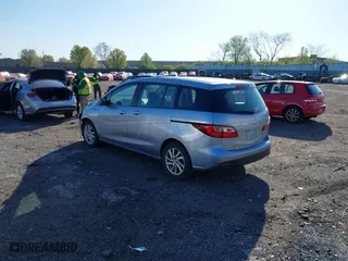 2012 Mazda Mazda5 Sport with VIN JM1CW2BL7C0105928, listed as a IAAI auction lot 42061224 with 59,993 mi miles. Bid and sale history available at carsss.com. Image 3.