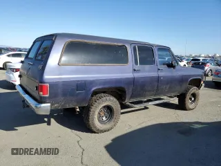1991 GMC Suburban z VIN 1GKEV16K9MF510909, wystawiony jako Copart lot #81326004 z przebiegiem 216 778 mil mil oraz Tytuł czysty. Historia ofert i sprzedaży dostępna na DreamBid. Obrazek 3.