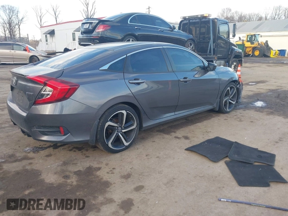 2019 Honda Civic Sport with VIN 2HGFC2F8XKH503867, listed as a IAAI auction lot 41533506 with 66,650 mi miles and . Bid and sale history available at DreamBid. Image 4.
