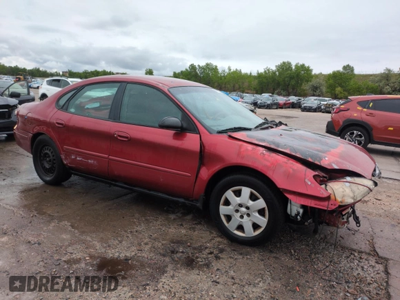 2001 Ford Taurus LX with VIN 1FAFP52UX1A176008, listed as a Copart auction lot 58983935 with 123,985 mi miles and Salvage title. Bid and sale history available at DreamBid. Image 4.