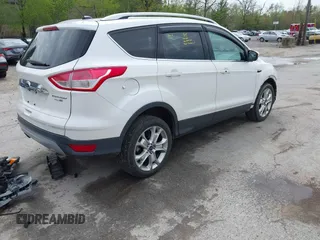 2016 Ford Escape Titanium with VIN 1FMCU9J98GUA00832, listed as a IAAI auction lot 42188941 with 90,764 mi miles and . Bid and sale history available at DreamBid. Image 4.