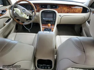2004 Jaguar XJ with VIN SAJWA71C34SG19800, listed as a Copart auction lot 71877194 with 157,051 mi miles and Salvage Title. Bid and sale history available at carsss.com. Image 8.