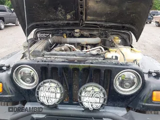 2004 Jeep Wrangler X z VIN 1J4FA39SX4P730504, wystawiony jako IAAI lot #42342491 z przebiegiem 112 942 mil mil oraz . Historia ofert i sprzedaży dostępna na DreamBid. Obrazek 10.