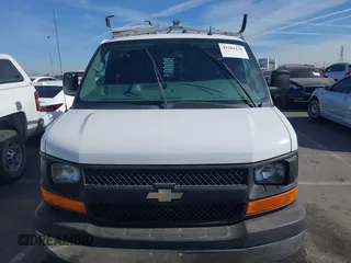 2014 Chevrolet Express Cargo Van with VIN 1GCWGFCB2E1122236, listed as a IAAI auction lot 41381131 with 70,696 mi miles. Bid and sale history available at carsss.com. Image 6.