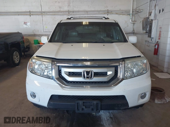 2010 Honda Pilot Touring with VIN 5FNYF4H95AB019903, listed as a IAAI auction lot 42196082 with 233,527 mi miles and . Bid and sale history available at carsss.com. Image 12.