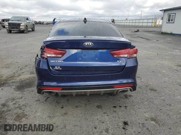 2018 Kia Optima SX with VIN 5XXGV4L25JG230508, listed as a Copart auction lot 56423135 with 100,575 mi miles and Salvage title. Bid and sale history available at DreamBid. Image 6.