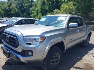 2023 Toyota Tacoma SR with VIN 3TYCZ5AN2PT141576, listed as a IAAI auction lot 42492127 with 43,431 mi miles and . Bid and sale history available at DreamBid. Image 2.