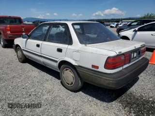 1991 Toyota Corolla z VIN JT2AE94A6M3427211, wystawiony jako Copart lot #60075885 z przebiegiem 179 936 mil mil oraz Czysty tytuł • Clean title. Historia ofert i sprzedaży dostępna na DreamBid. Obrazek 2.
