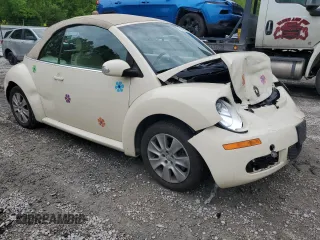 2009 Volkswagen Beetle S with VIN 3VWRF31Y99M409195, listed as a Copart auction lot 55010054 with 99,635 mi miles and Salvage title. Bid and sale history available at DreamBid. Image 4.