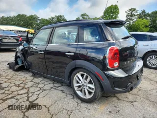 2014 MINI Countryman S with VIN WMWZC3C56EWP25479, listed as a Copart auction lot 61197525 with 101,146 mi miles and Salvage title. Bid and sale history available at DreamBid. Image 2.