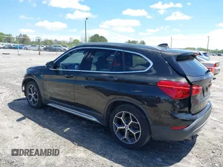 2016 BMW X1 xDrive28i with VIN WBXHT3C3XGP889833, listed as a IAAI auction lot 39118131 with 111,343 mi miles. Bid and sale history available at carsss.com. Image 3.