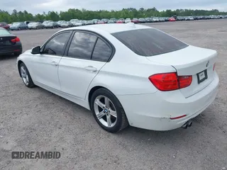 2015 BMW 3 Series 328i with VIN WBA3A5C50FF608327, listed as a IAAI auction lot 42136156 with 213,945 mi miles. Bid and sale history available at carsss.com. Image 3.