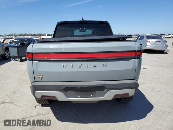 2022 Rivian R1T Adventure z VIN 7FCTGAAAXNN014983, wystawiony jako Copart lot #48987605 z przebiegiem Nie podano mil oraz Szkoda całkowita • Salvage title. Historia ofert i sprzedaży dostępna na DreamBid. Obrazek 6.