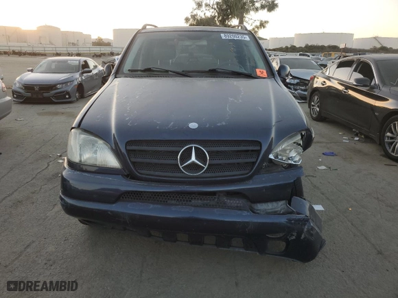 2001 Mercedes-Benz M-Class with VIN 4JGAB72E91A260677, listed as a Copart auction lot 89200235 with 180,414 mi miles and Salvage Title. Bid and sale history available at carsss.com. Image 5.