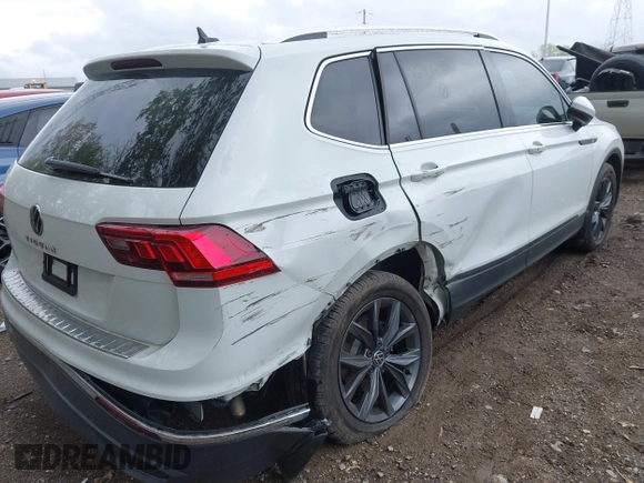 2022 Volkswagen Tiguan SE z VIN 3VV3B7AX4NM125651, wystawiony jako IAAI lot #42114490 z przebiegiem 67 628 mil mil oraz . Historia ofert i sprzedaży dostępna na DreamBid. Obrazek 6.