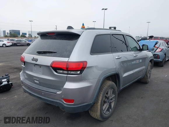2016 Jeep Grand Cherokee Laredo z VIN 1C4RJFAG3GC457431, wystawiony jako IAAI lot #41993167 z przebiegiem 61 427 mil mil oraz . Historia ofert i sprzedaży dostępna na DreamBid. Obrazek 4.