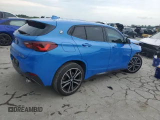 2023 BMW X2 sDrive28i with VIN WBXYH9C08P5V32303, listed as a Copart auction lot 64951994 with 22,462 mi miles and Salvage Title. Bid and sale history available at carsss.com. Image 3.