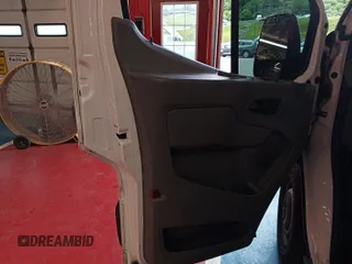 2016 Ford Transit Cargo z VIN 1FTYE1YM3GKB15532, wystawiony jako IAAI lot #42788480 z przebiegiem 64 600 mil mil oraz . Historia ofert i sprzedaży dostępna na DreamBid. Obrazek 29.