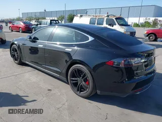 2014 Tesla Model S P85D with VIN 5YJSA1H22EFP65530, listed as a IAAI auction lot 41959941 with 76,532 mi miles and . Bid and sale history available at DreamBid. Image 3.