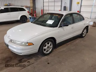 1999 Oldsmobile Intrigue GX z VIN 1G3WH52K6XF328030, wystawiony jako IAAI lot #42334804 z przebiegiem Nie podano mil oraz . Historia ofert i sprzedaży dostępna na DreamBid. Obrazek 2.