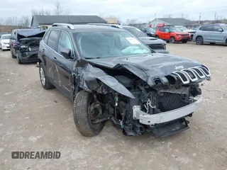 2015 Jeep Cherokee Limited with VIN 1C4PJMDS5FW587879, listed as a IAAI auction lot 41864622 with 143,843 mi miles. Bid and sale history available at carsss.com. Image 1.