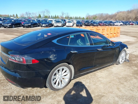 2016 Tesla Model S 90D with VIN 5YJSA1E22GF174301, listed as a IAAI auction lot 38867108 with 60,715 mi miles and . Bid and sale history available at DreamBid. Image 4.