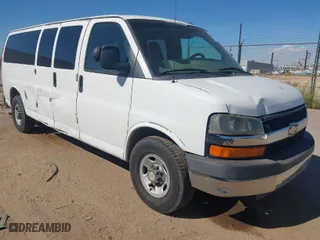 2014 Chevrolet Express Passenger LT with VIN 1GAZG1FG2E1135391, listed as a IAAI auction lot 42047248 with 174,215 mi miles. Bid and sale history available at carsss.com. Image 1.