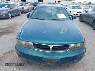 2001 Mitsubishi Diamante LS z VIN 6MMAP67P51T007599, wystawiony jako IAAI lot #42425149 z przebiegiem 115 132 mil mil oraz . Historia ofert i sprzedaży dostępna na DreamBid. Obrazek 6.