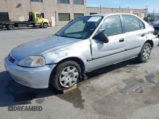 1999 Honda Civic LX with VIN JHMEJ6670XS000958, listed as a IAAI auction lot 41620949 with 93,698 mi miles and . Bid and sale history available at DreamBid. Image 2.