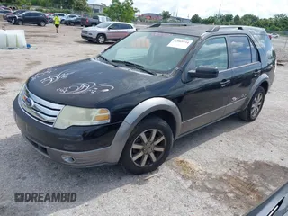 2008 Ford Taurus X SEL z VIN 1FMDK02W18GA42379, wystawiony jako IAAI lot #42669734 z przebiegiem 255 635 mil mil oraz . Historia ofert i sprzedaży dostępna na DreamBid. Obrazek 2.