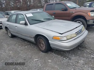 1997 Ford Crown Victoria z VIN 2FALP73W1VX164003, wystawiony jako IAAI lot #41497149 z przebiegiem 172 831 mil mil oraz . Historia ofert i sprzedaży dostępna na DreamBid. Obrazek 1.