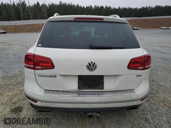 2015 Volkswagen Touareg Lux с VIN WVGEP9BP2FD002247, выставлен на аукционе Copart как лот 41924615 с пробегом 127 543 миль миль и Списание • Salvage title. История ставок и продаж доступна на DreamBid. Изображение 6.