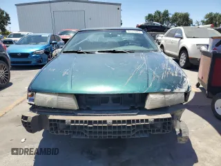 1995 Mercury Cougar z VIN 1MELM62W5SH627799, wystawiony jako Copart lot #61115064 z przebiegiem 31 957 mil mil oraz Szkody całkowita. Historia ofert i sprzedaży dostępna na DreamBid. Obrazek 5.