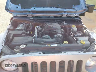 2016 Jeep Wrangler Sahara z VIN 1C4AJWBGXGL120329, wystawiony jako IAAI lot #40239916 z przebiegiem 96 731 mil mil oraz . Historia ofert i sprzedaży dostępna na DreamBid. Obrazek 10.
