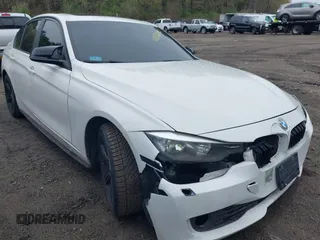 2014 BMW 3 Series 328i xDrive with VIN WBA3B5C56EP544400, listed as a IAAI auction lot 42172100 with 242,472 mi miles. Bid and sale history available at carsss.com. Image 1.