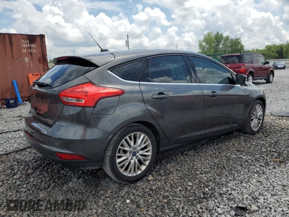 2015 Ford Focus Titanium z VIN 1FADP3N28FL239706, wystawiony jako Copart lot #62478895 z przebiegiem 143 536 mil mil oraz Szkoda całkowita • Salvage title. Historia ofert i sprzedaży dostępna na DreamBid. Obrazek 3.