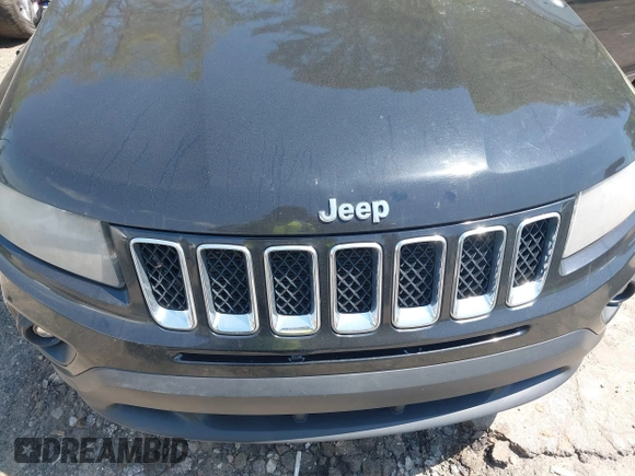 2014 Jeep Compass Sport with VIN 1C4NJCBA0ED511217, listed as a IAAI auction lot 42008976 with 210,780 mi miles. Bid and sale history available at carsss.com. Image 6.