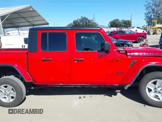 2022 Jeep Gladiator Willys Sport z VIN 1C6HJTAG0NL180848, wystawiony jako IAAI lot #41778129 z przebiegiem Nie podano mil oraz . Historia ofert i sprzedaży dostępna na DreamBid. Obrazek 14.
