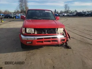 1999 Nissan Frontier XE with VIN 1N6ED26Y2XC312863, listed as a Copart auction lot 42259015 with 212,666 mi miles and Salvage title. Bid and sale history available at DreamBid. Image 11.