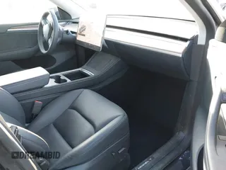 2024 Tesla Model Y with VIN 7SAYGDED5RF103983, listed as a IAAI auction lot 41933836 with 11,398 mi miles and . Bid and sale history available at DreamBid. Image 5.