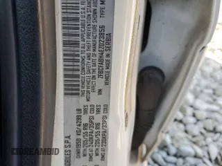 2014 FIAT 500L Easy z VIN ZFBCFABH4EZ023856, wystawiony jako Copart lot #76285024 z przebiegiem 131 343 mil mil oraz Szkoda całkowita • Salvage title. Historia ofert i sprzedaży dostępna na DreamBid. Obrazek 14.