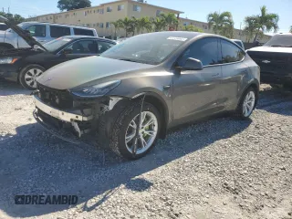 2021 Tesla Model Y Standard Range with VIN 5YJYGDED2MF103056, listed as a Copart auction lot 41729065 with 54,282 mi miles and Salvage Title. Bid and sale history available at carsss.com. Image 1.