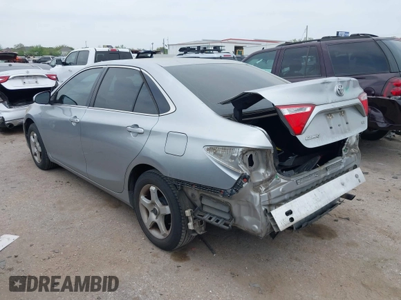 2015 Toyota Camry XLE with VIN 4T4BF1FKXFR472201, listed as a IAAI auction lot 41883944 with 143,296 mi miles and . Bid and sale history available at DreamBid. Image 3.