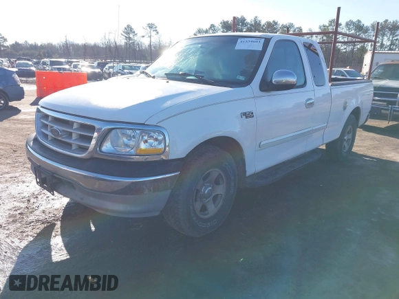 2000 Ford F-150 XL with VIN 1FTZX172XYNB36456, listed as a IAAI auction lot 41554603 with 239,766 mi miles. Bid and sale history available at carsss.com. Image 2.