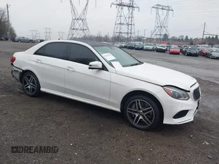 2014 Mercedes-Benz E 550 Sport with VIN WDDHF9BBXEA940995, listed as a IAAI auction lot 41872452 with 50,451 mi miles and . Bid and sale history available at DreamBid. Image 1.