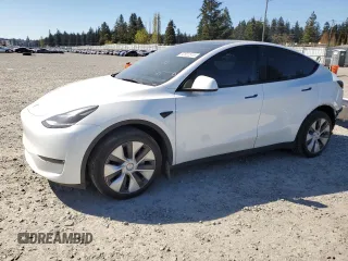 2023 Tesla Model Y Long Range z VIN 7SAYGDEE7PF788932, wystawiony jako Copart lot #52822515 z przebiegiem 33 007 mil mil oraz Szkoda całkowita • Salvage title. Historia ofert i sprzedaży dostępna na DreamBid. Obrazek 1.