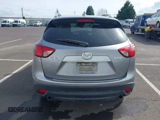 2014 Mazda CX-5 Grand Touring with VIN JM3KE4DY9E0375014, listed as a IAAI auction lot 42000382 with 110,584 mi miles and . Bid and sale history available at DreamBid. Image 17.