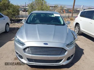 2014 Ford Fusion Titanium Hybrid with VIN 3FA6P0RUXER103516, listed as a IAAI auction lot 42004602 with 128,287 mi miles and . Bid and sale history available at carsss.com. Image 12.