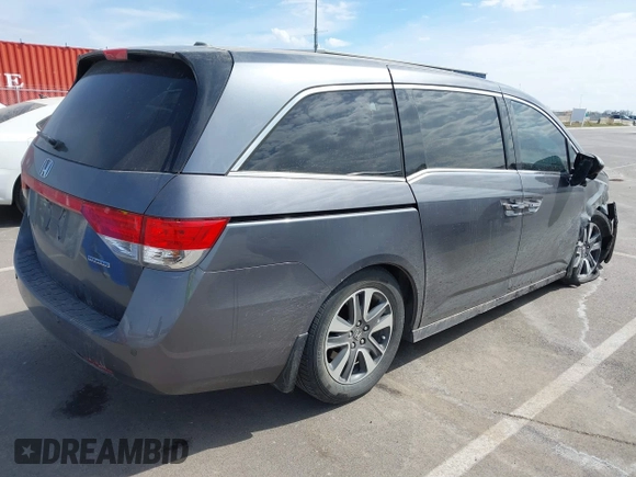 2014 Honda Odyssey Touring with VIN 5FNRL5H91EB093540, listed as a IAAI auction lot 41887412 with 202,076 mi miles and . Bid and sale history available at DreamBid. Image 4.
